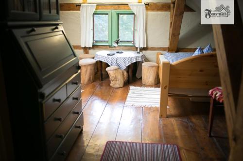 a small kitchen with a table in a tiny house at Forsthaus Leiner Berg in Dessau