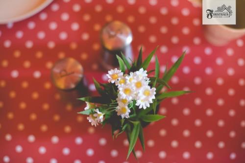 a bunch of white flowers on top of a table at Forsthaus Leiner Berg in Dessau