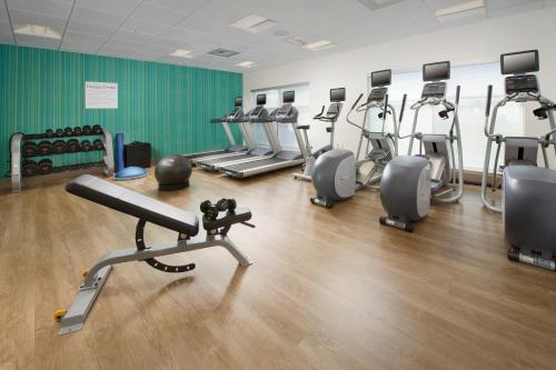 a gym with several treadmills and cardio machines at Holiday Inn Express & Suites New Braunfels by IHG in New Braunfels