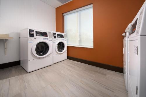 a laundry room with a washer and dryer at Holiday Inn Express & Suites New Braunfels by IHG in New Braunfels