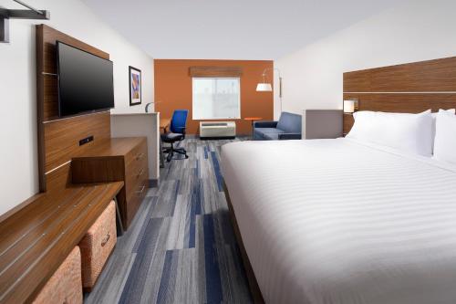 a hotel room with two beds and a television at Holiday Inn Express & Suites New Braunfels, an IHG Hotel in New Braunfels