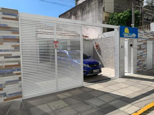 a garage door with a car parked behind it at Pousada Praia Boa Viagem in Recife