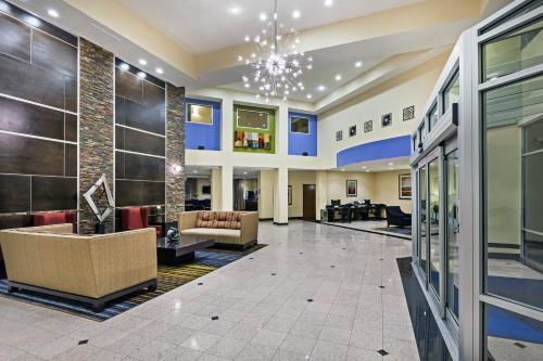 a lobby of a hospital with couches and chairs at Holiday Inn Express Hotel & Suites Houston-Downtown Convention Center by IHG in Houston