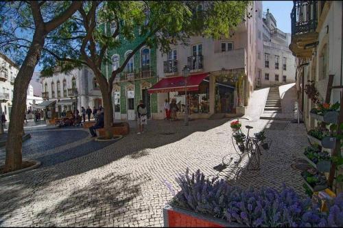 a cobblestone street in a city with buildings at Townhouse w Beautiful terrace - 360 degrees views! in Lagos
