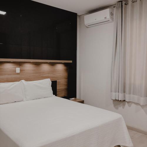 Säng eller sängar i ett rum på Petri Plaza Hotel