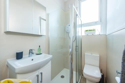 a bathroom with a toilet and a sink and a shower at The Westfield in Edinburgh