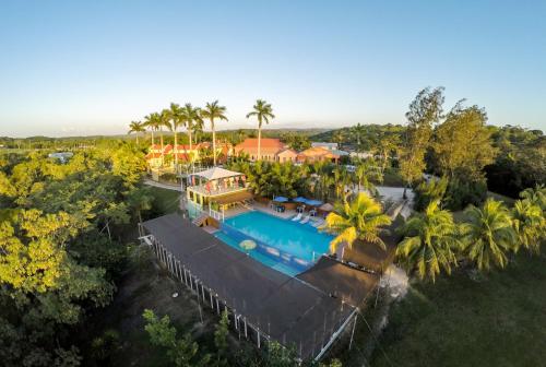 an aerial view of a house with a swimming pool at Rumors Resort Hotel in San Ignacio