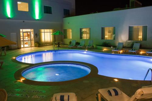 a large swimming pool in a large room at Holiday Inn Hotel & Suites Hermosillo Aeropuerto, an IHG Hotel in Hermosillo