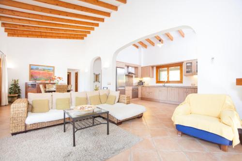 a living room with a couch and chairs and a table at Correfoc in Sa Pobla