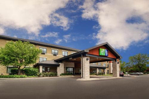 a hotel with a sign on the front of it at Holiday Inn Express & Suites Aurora - Naperville, an IHG Hotel in Aurora