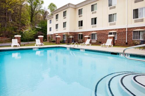 a large swimming pool in front of a building at Holiday Inn Express Hotel & Suites Cherokee-Casino by IHG in Cherokee