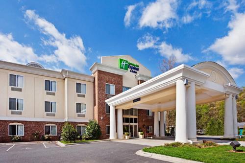 a hotel with a hilton sign on top of a building at Holiday Inn Express Hotel & Suites Cherokee-Casino by IHG in Cherokee