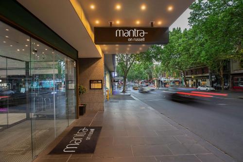 a street sign on the corner of a street at Mantra on Russell in Melbourne