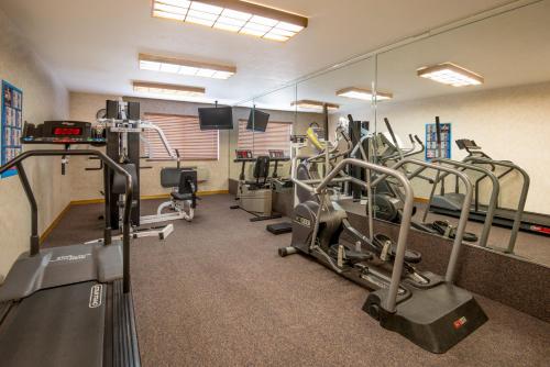 a gym with treadmills and elliptical machines at Holiday Inn Express Hotel & Suites Raton, an IHG Hotel in Raton