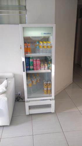 a refrigerator filled with lots of food and drinks at Casa da Esquina Pousada in Recife