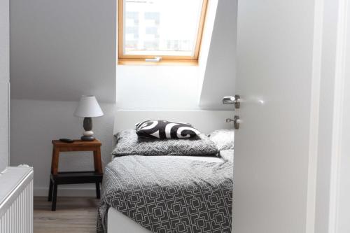 a bedroom with a bed with a pillow on it at Ferienwohnung Bauhausblick in Dessau
