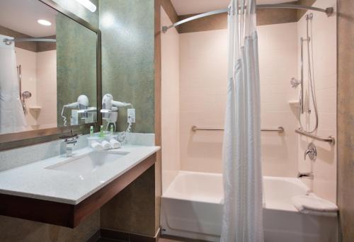 A bathroom at Holiday Inn Express & Suites St Louis Airport, an IHG Hotel