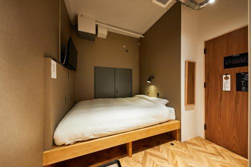 Postel nebo postele na pokoji v ubytování mizuka Daimyo 6 - unmanned hotel -