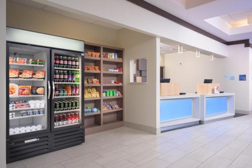 a store interior with a large refrigeratorasteryasteryasteryasteryasteryasteryasteryasteryastery at Holiday Inn Express Hotel & Suites Chattanooga Downtown, an IHG Hotel in Chattanooga
