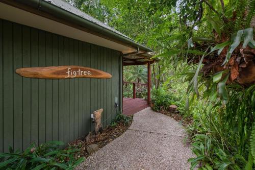 a house with a surfboard on the side of it at Hunchy Hideaway in Montville