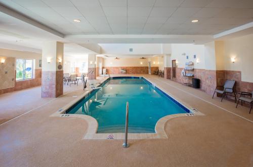 a large swimming pool in a hotel room at Holiday Inn Hotel & Suites Lake City by IHG in Lake City