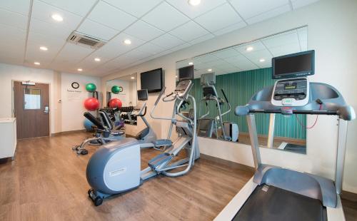 a gym with exercise equipment in a room at Holiday Inn Express & Suites Columbia-I-26 @ Harbison Blvd by IHG in Columbia