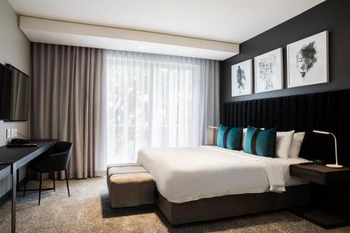 Letto o letti in una camera di The Capital Empire