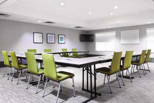 a conference room with a large table and chairs at Holiday Inn Express & Suites - Columbus Airport East by IHG in Columbus