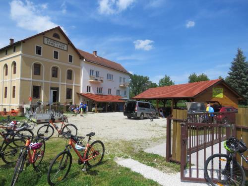 a group of bikes parked in front of a building at Mill House Apartment and Camping in Ljutomer