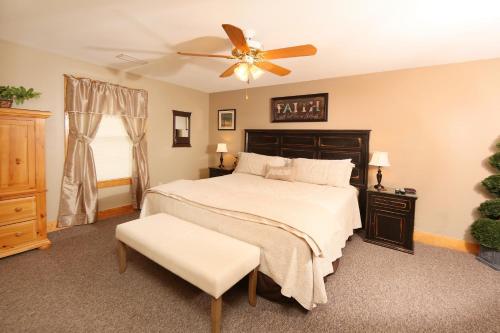 a bedroom with a bed and a ceiling fan at Three-Bedroom Apartment in Pigeon Forge