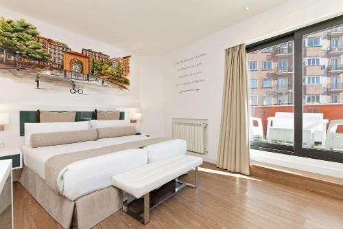 Postel nebo postele na pokoji v ubytování Grupotel Mayorazgo