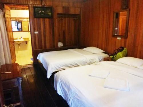 Un ou plusieurs lits dans un hébergement de l'établissement Monkey Island Resort