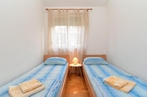 Postel nebo postele na pokoji v ubytování Apartments Edin 1359