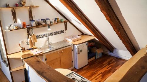 an overhead view of a kitchen in an attic at River loft in Ilirska Bistrica
