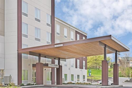 a building with awning in front of a building at Holiday Inn Express & Suites New Cumberland by IHG in New Cumberland
