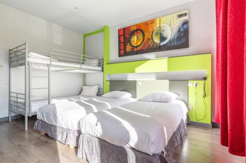 Tempat tidur dalam kamar di Hotel Esplanade