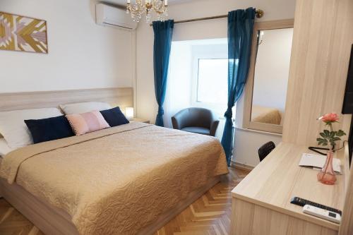 Ein Bett oder Betten in einem Zimmer der Unterkunft Anna Panzió & Wellness Siófok