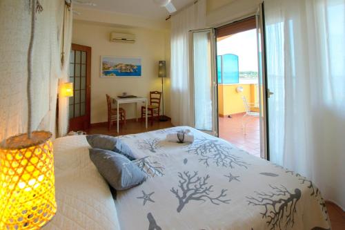 Palermo Mare Holidays tesisinde bir odada yatak veya yataklar