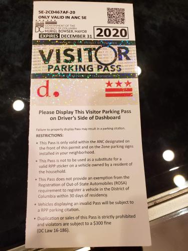 a sign for a ticket for a parking pass at Spacious & Bright home In Bloomingdale/ Truxton DC in Washington