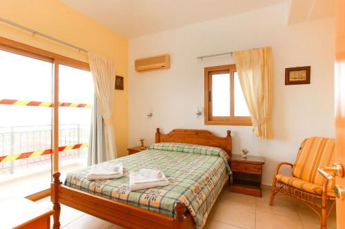 Ένα ή περισσότερα κρεβάτια σε δωμάτιο στο Villa Hera