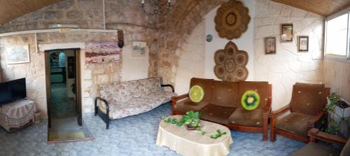 a living room with a couch and a table at Jaffa Gate Hostel in Jerusalem
