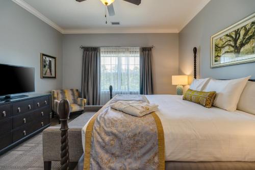 a bedroom with a large bed and a flat screen tv at Holiday Inn Club Vacations Williamsburg Resort in Williamsburg