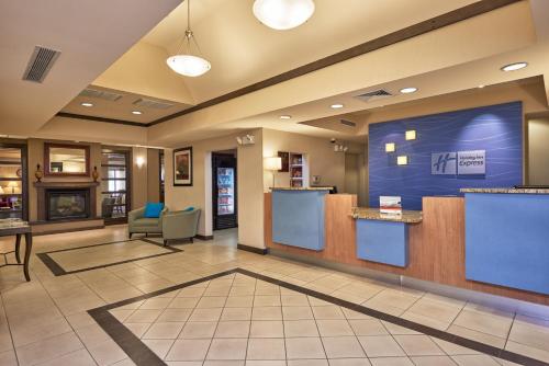 a very large room with a lot of doors at Holiday Inn Express & Suites El Paso Airport, an IHG Hotel in El Paso