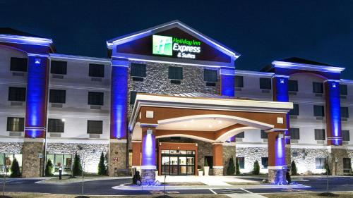 a hotel with a sign on the front of it at Holiday Inn Express & Suites Elkton - University Area by IHG in Elkton