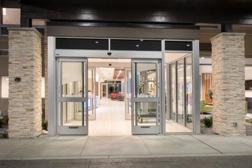 an entrance to a building with revolving doors at Holiday Inn Express & Suites - Ely by IHG in Ely