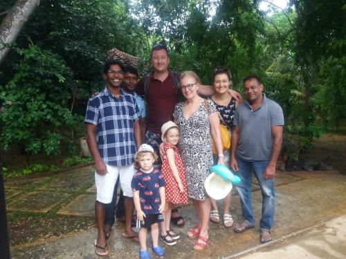 a group of people posing for a picture at Heaven in Satinwoods in Tangalle