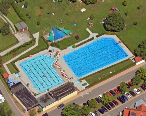 an overhead view of two swimming pools in a park at Gräfin von Paris - Appartement mit Saunanutzung in Burgbernheim