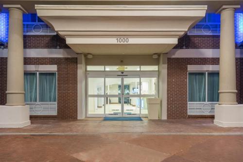 an entrance to a brick building with a glass door at Holiday Inn Express Hotel & Suites Frankfort by IHG in Frankfort