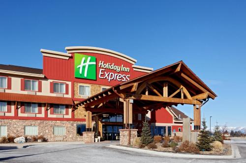 a hotel with a hilton inn express sign in front at Holiday Inn Express Hotel & Suites Kalispell by IHG in Kalispell