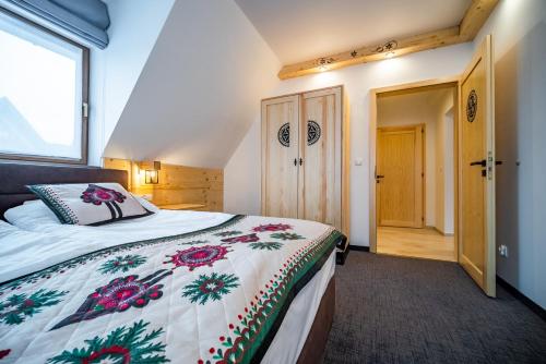 Katil atau katil-katil dalam bilik di Apartamenty Góralskie Zakopane